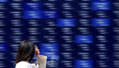 Asia shares rise on AI optimism, receding Fed cut bets lift dollar