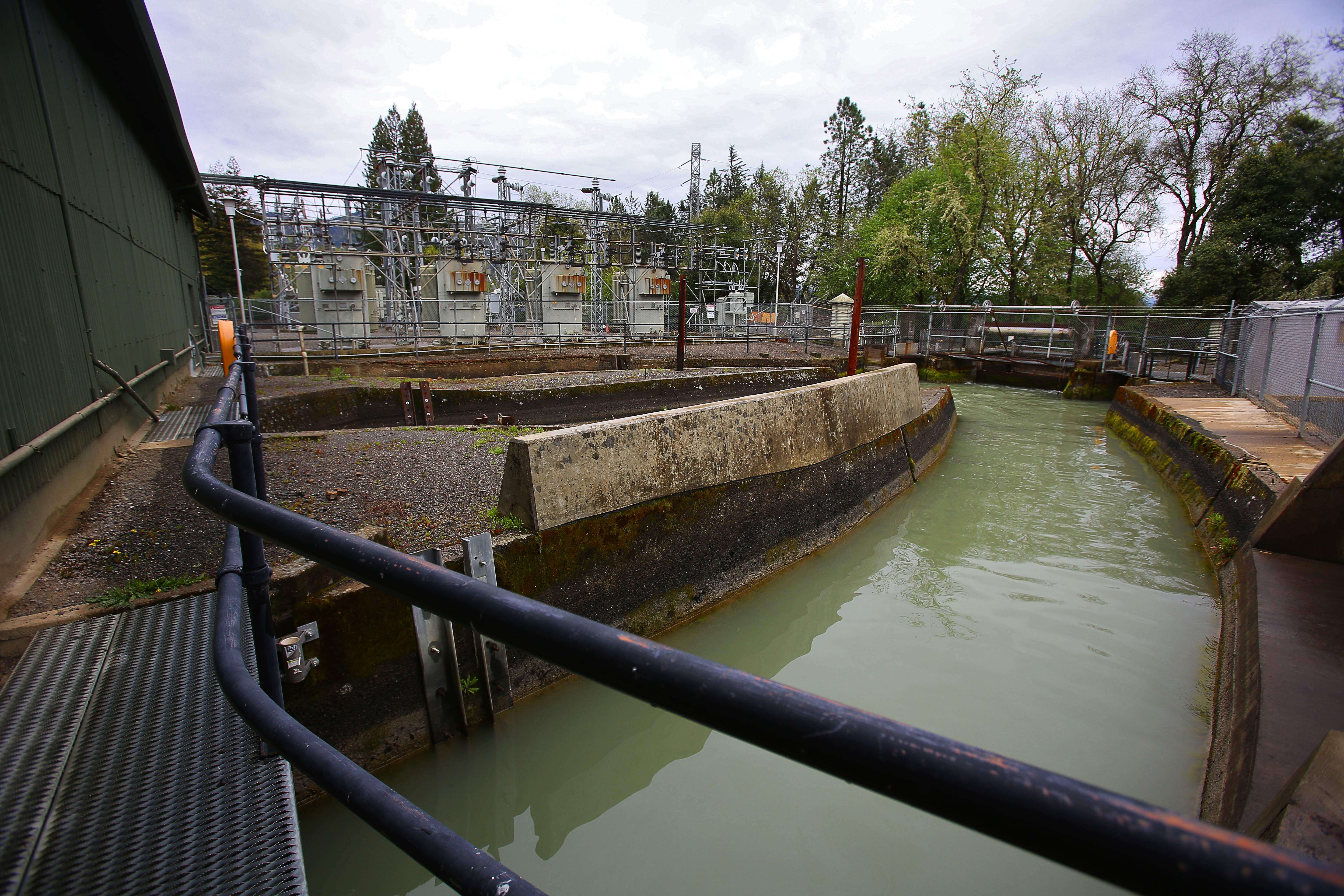 Water diverted from the Eel River flows out of the...