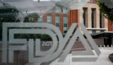 The US Food and Drug Administration building behind FDA logos at a bus stop on the agency's campus in Silver Spring, Md, on Aug. 2, 2018.