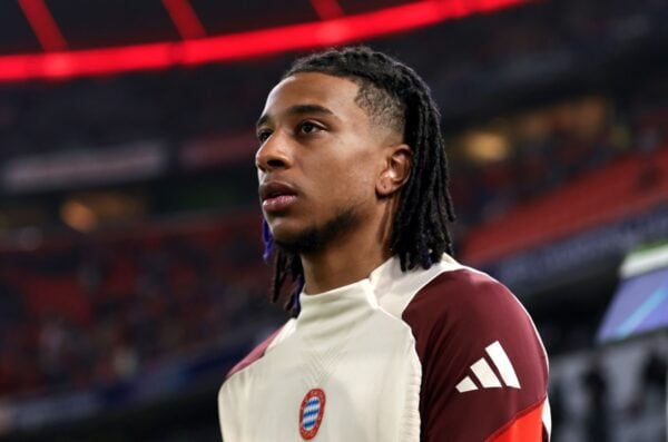 MUNICH, GERMANY - NOVEMBER 06: Michael Olise of Bayern Munich looks on as he prepares to warm up prior to the UEFA Champions League 2024/25 League Phase MD4 match between FC Bayern München and SL Benfica at Football Arena Munich on November 06, 2024 in Munich, Germany. (Photo by Leonhard Simon - UEFA/UEFA via Getty Images)