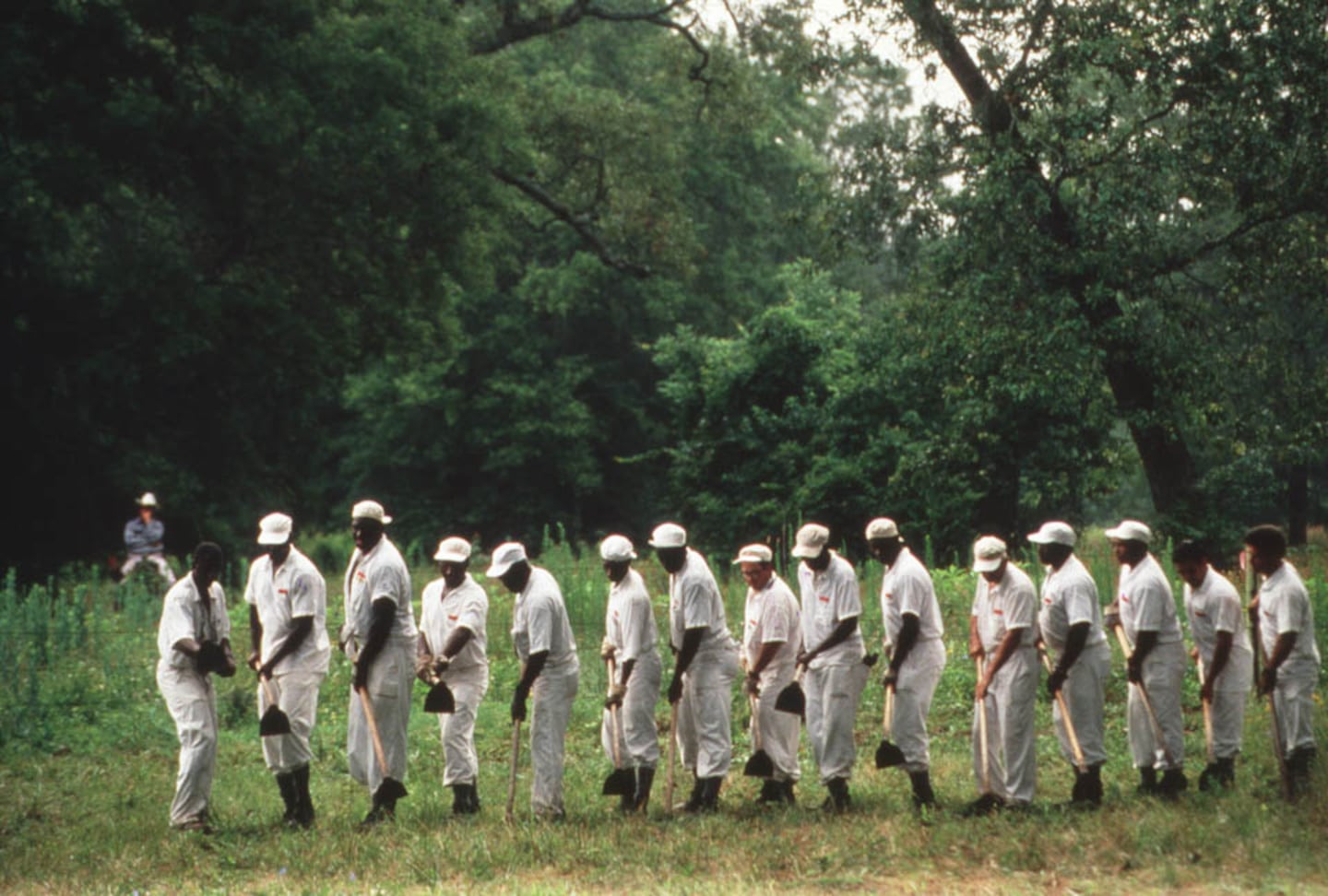 “Chain Gang,” a photo taken by Lou Jones in Huntsville, Texas, on May 4, 2011. Part of Jones's "Final Exposure" project, the image shows Death Row inmates working in a field.