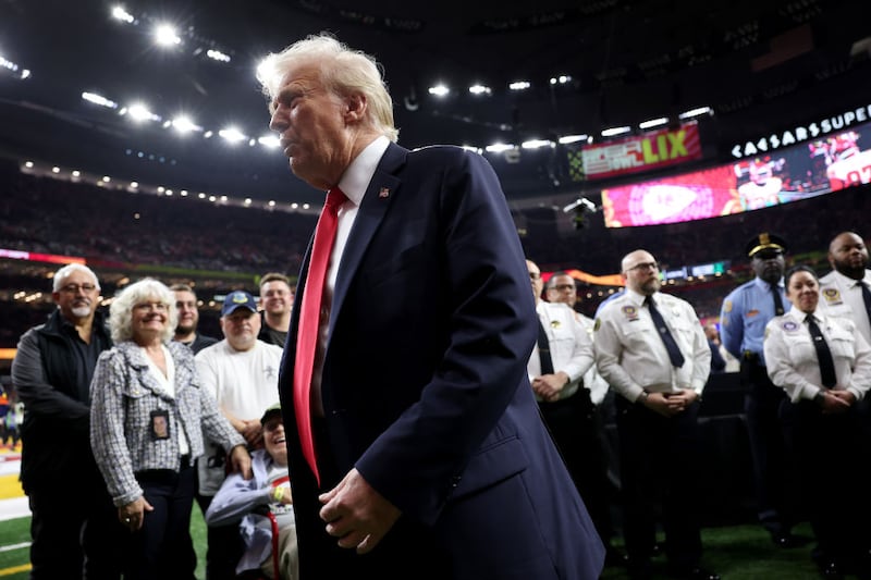 U.S. President Donald Trump reacts after posing with family members of victims in the January 1 attack on Bourbon Street and emergency responders prior to Super Bowl LIX between the Kansas City Chiefs and the Philadelphia Eagles at Caesars Superdome on February 09, 2025 in New Orleans, Louisiana.