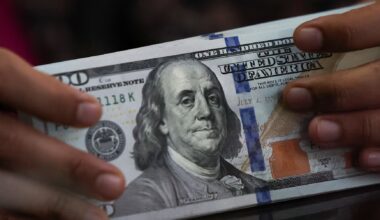Dollar stuck in tight range as focus shifts to economic data