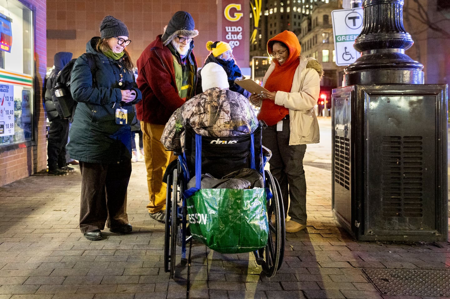 From left, Beckie Tachick, a nurse with the Boston Health Care for the Homeless Program, conducted a welfare check with an unhoused person last January.