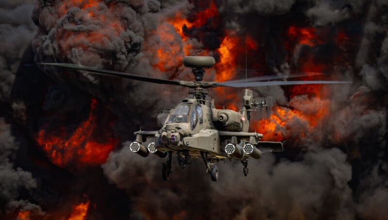 A military attack helicopter flies toward the viewer with large explosions and thick, dark smoke filling the background.