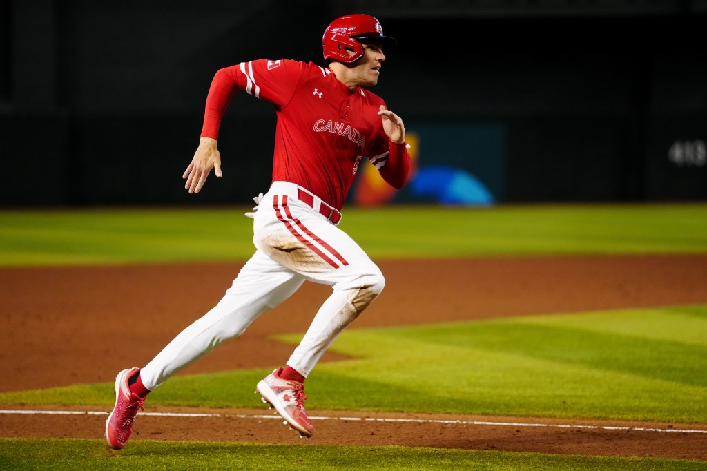 Team Canada baseball player running during the 2023 World Baseball Classic.