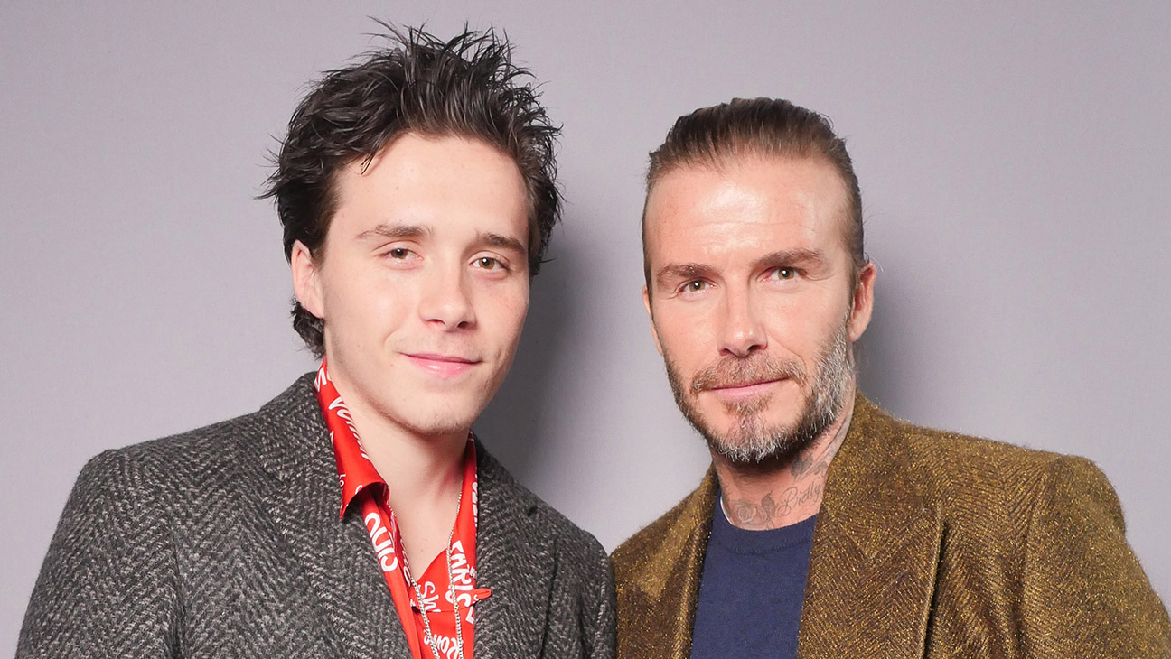 Brooklyn Beckham and David Beckham in the front row