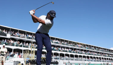 Former NFL receiver Larry Fitzgerald plays a tee shot on the 16th hole during the practice round pr...