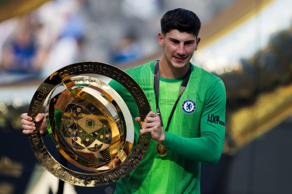 Mike Penders of Chelsea FC poses with the trophy during the