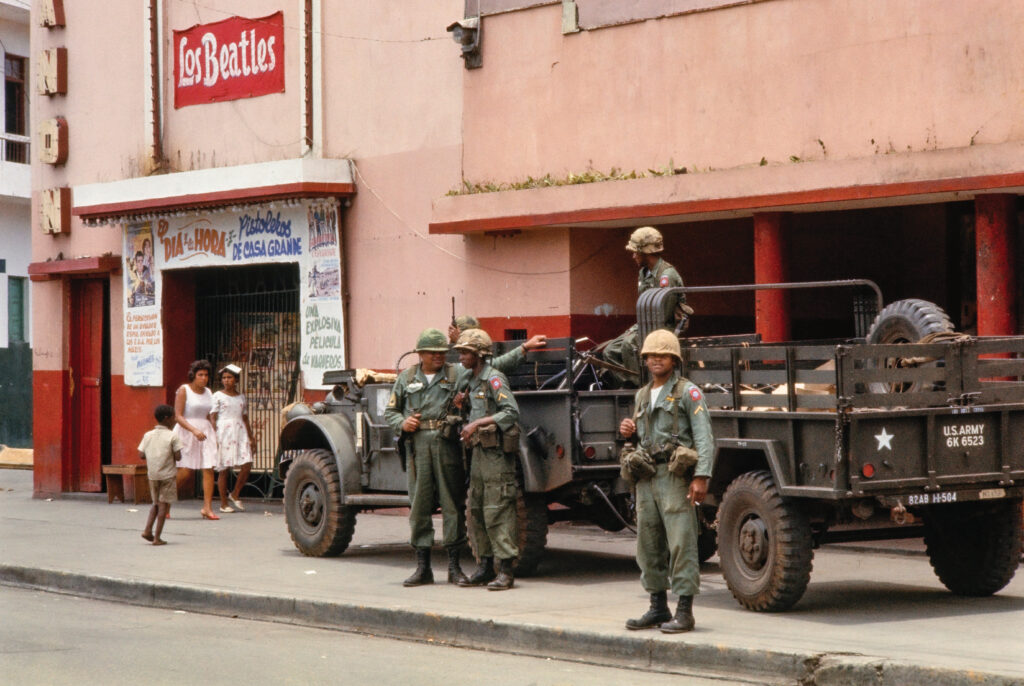 U.S. Army soldiers are posted outside a movie theater in Santo Domingo, the capital of the Dominican Republic, in 1965.