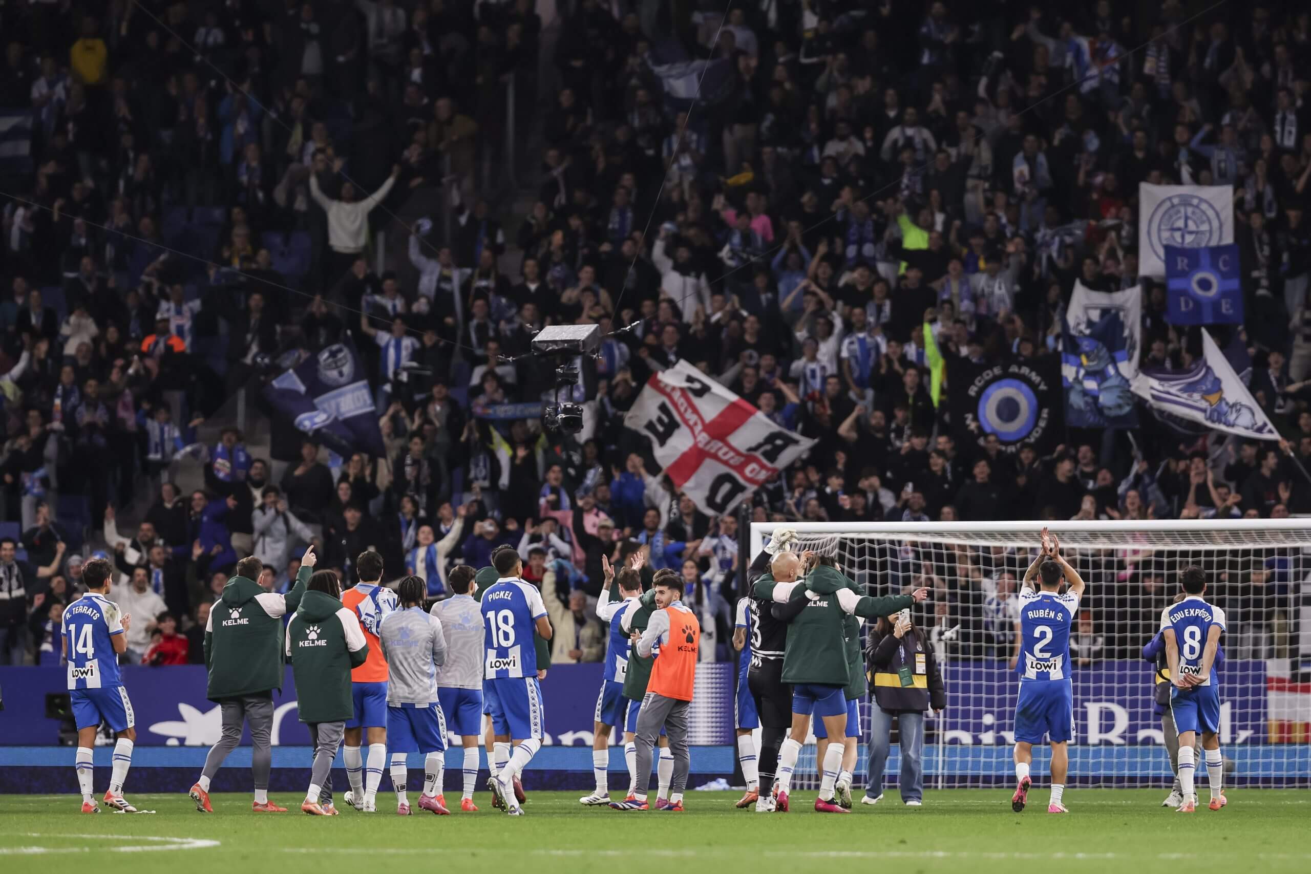 Espanyol celebrate with home fans after beating Rayo Vallecano in December 