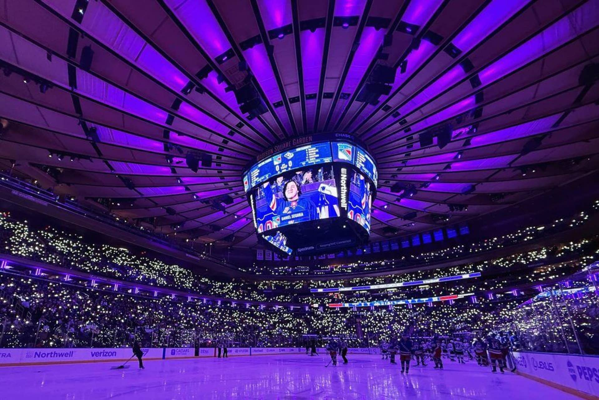 Fans hold up their cell phones for Hockey Fights Cancer night during the game between the New York Rangers and the Utah Mammoth at Madison Square Garden on January 05, 2026 in New York City.
