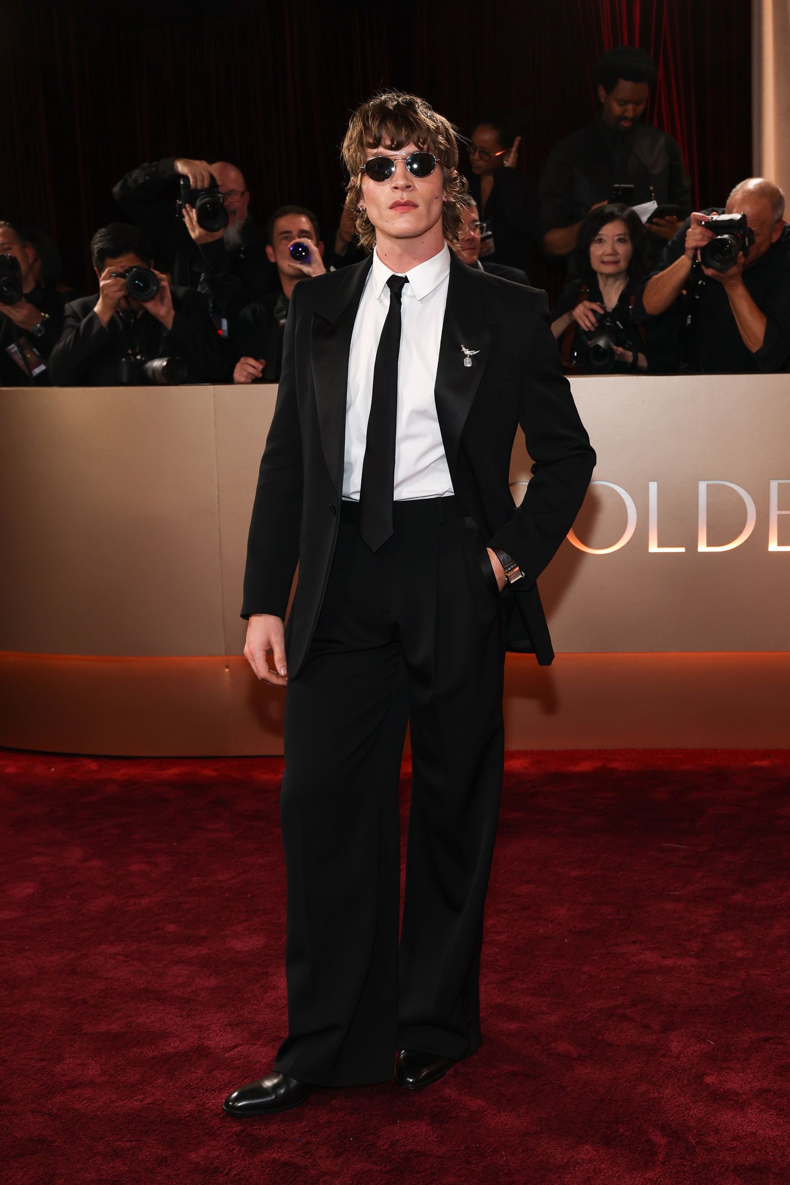 Image may contain Li Xi Carlos Bruce Stephen Gyllenhaal Clothing Formal Wear Suit Fashion Adult Person and Baby