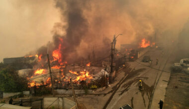 An aerial view of burning houses as a wildfire blazes through Concepción, Chile, on Jan. 18. Credit: Guillermo Salgado/AFP via Getty Images