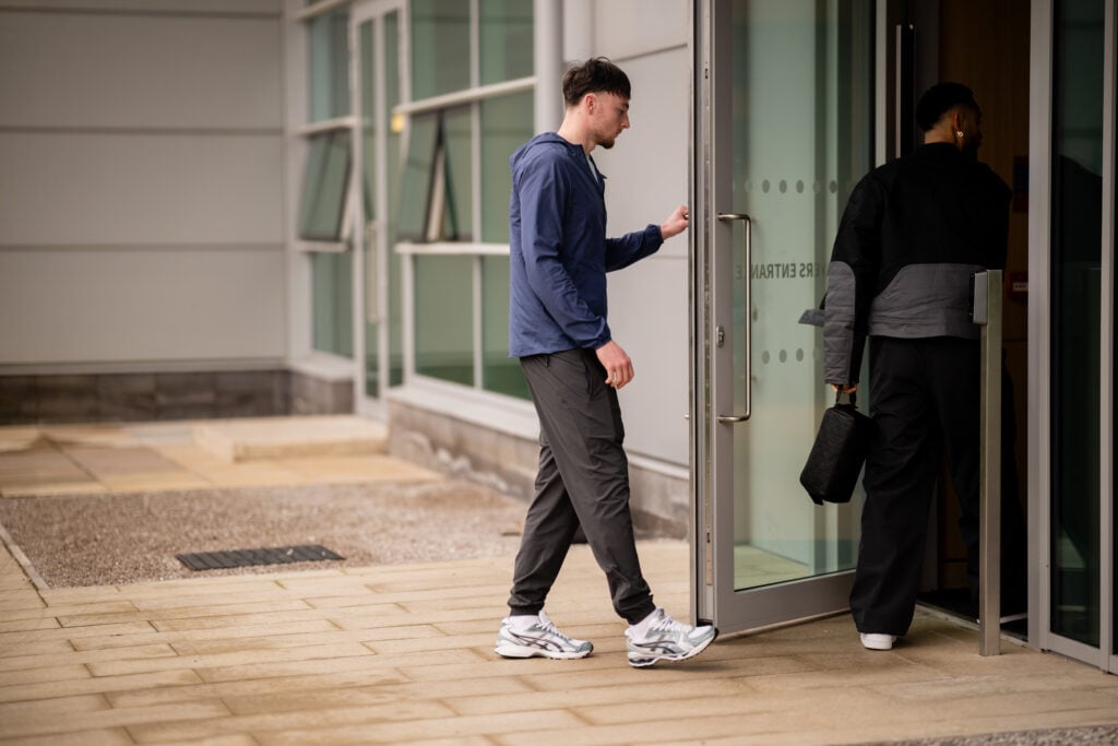 Elyh Harrison arrives for Manchester United Training Session