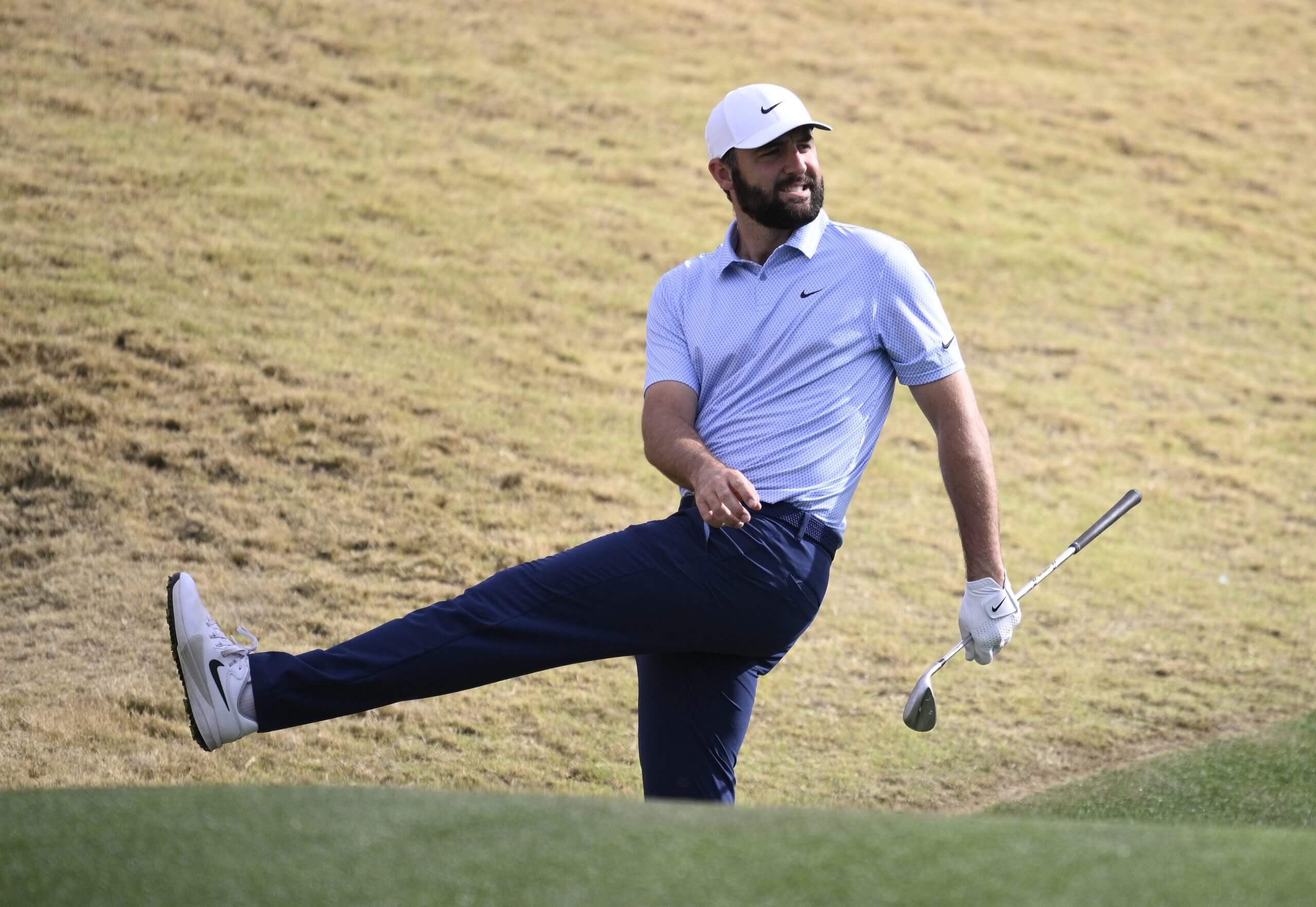 Scottie Scheffler kicks out his leg in a rare moment of frustration.