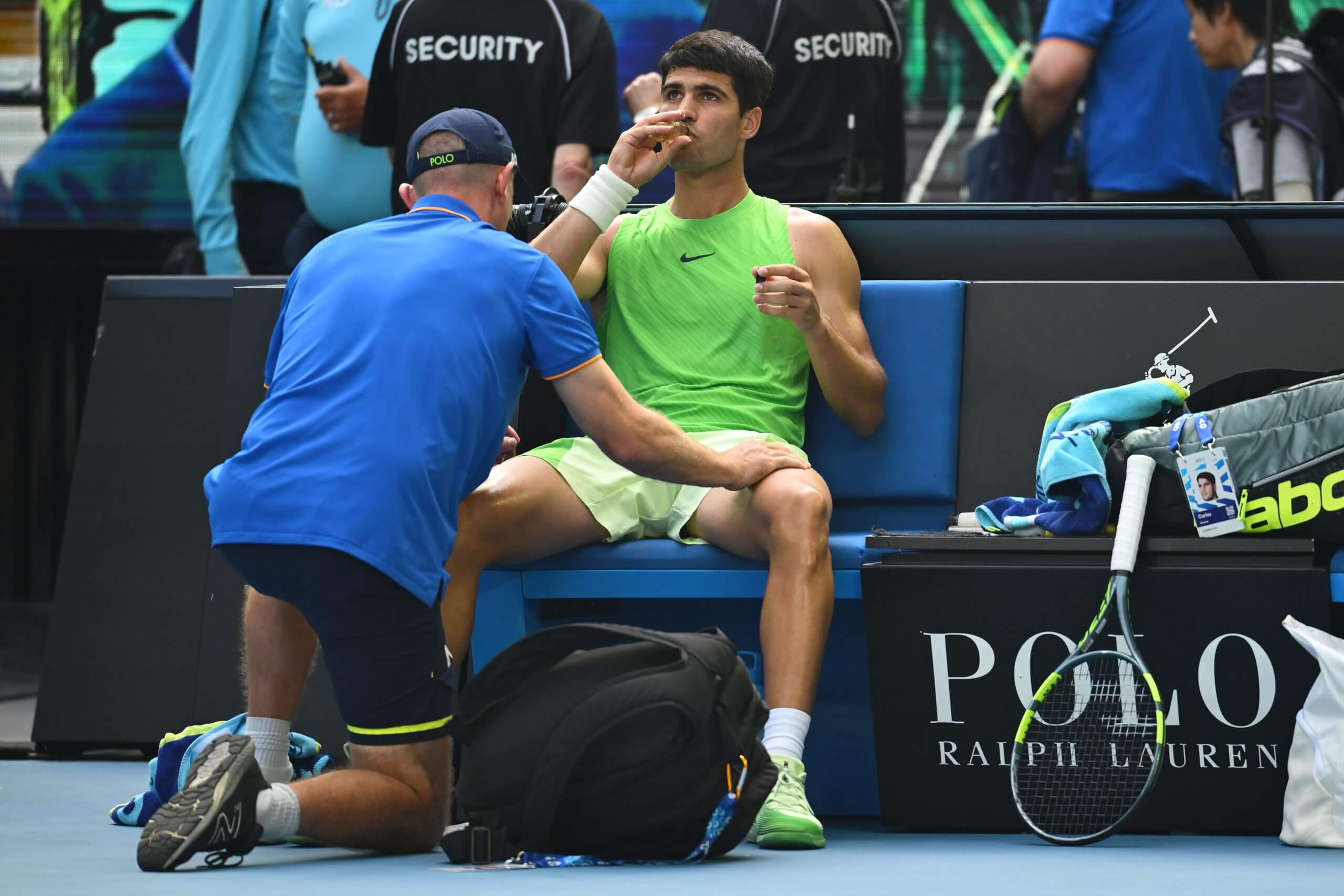 Carlos Alcaraz drinks pickle juice while receiving treatment