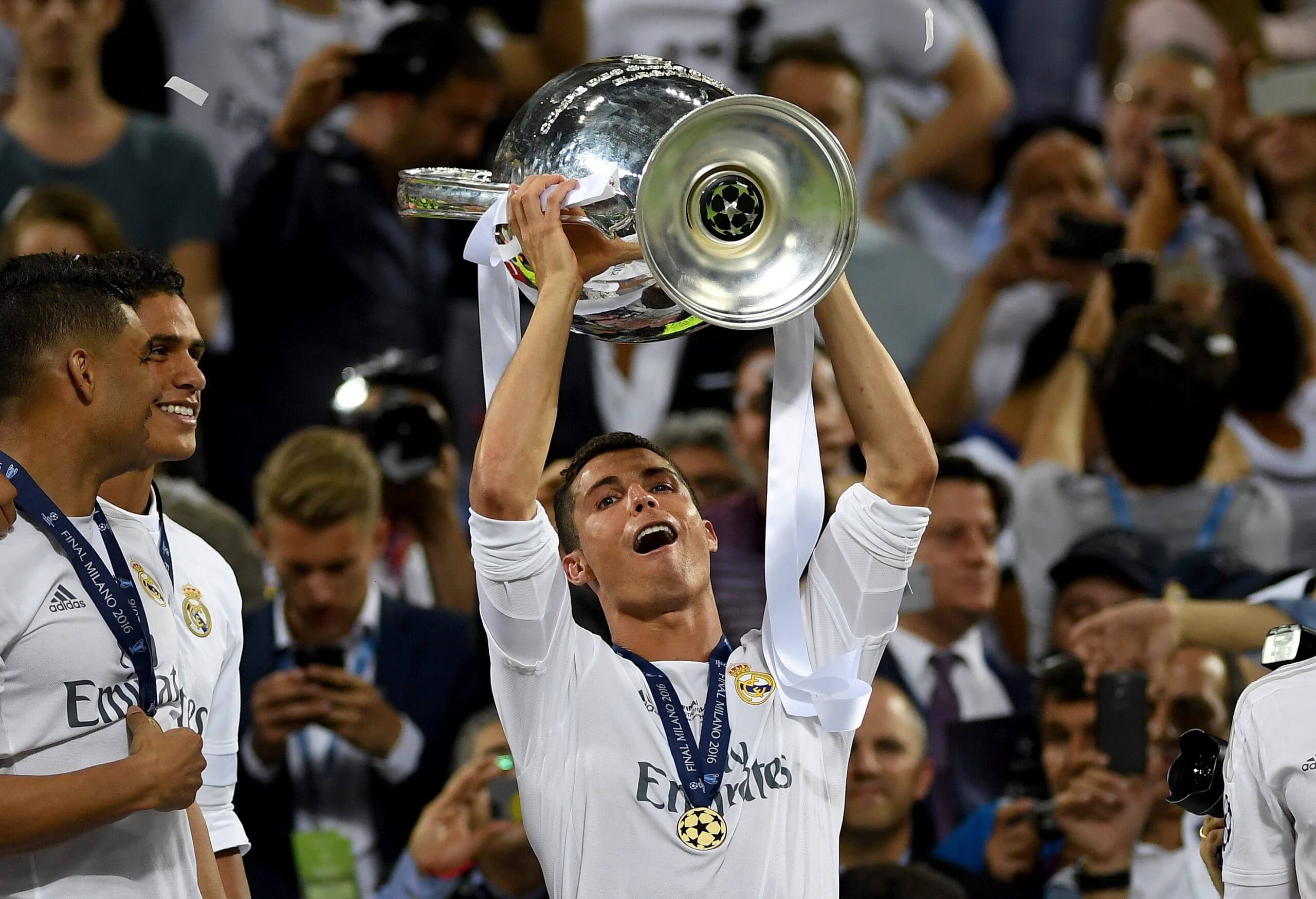 Cristiano Ronaldo raises the Champions League trophy.
