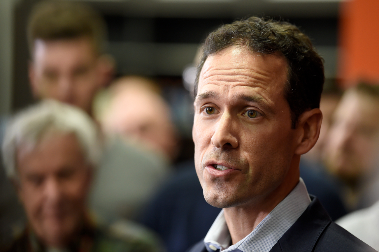 man speaks during press conferences