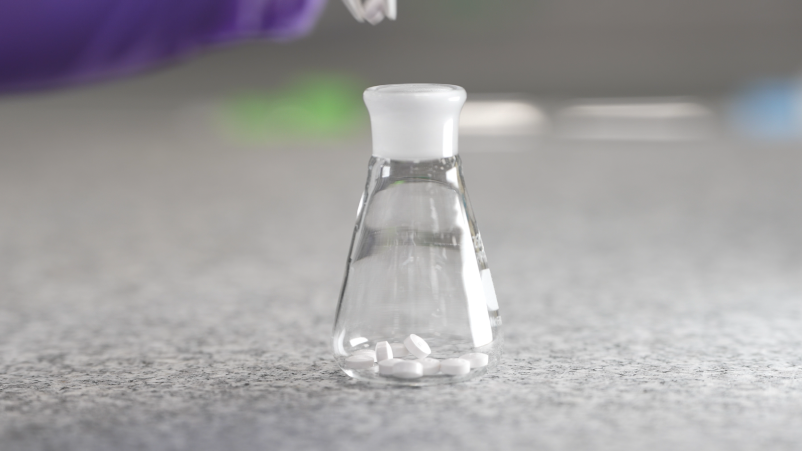 white pills in a small clear vial