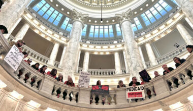 Hundreds of Idahoans gathered in the rotunda of the Idaho Capitol on Jan. 12, 2026, to protest budget cuts to the state’s Medicaid program. The protest, organized by Idaho Voices for Children, took place before the governor’s State of the State Address. (Photo by Christina Lords/Idaho Capital Sun)