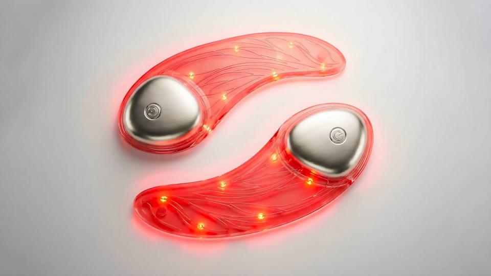 A pair of transparent eye masks with wires and bulbs inside them.