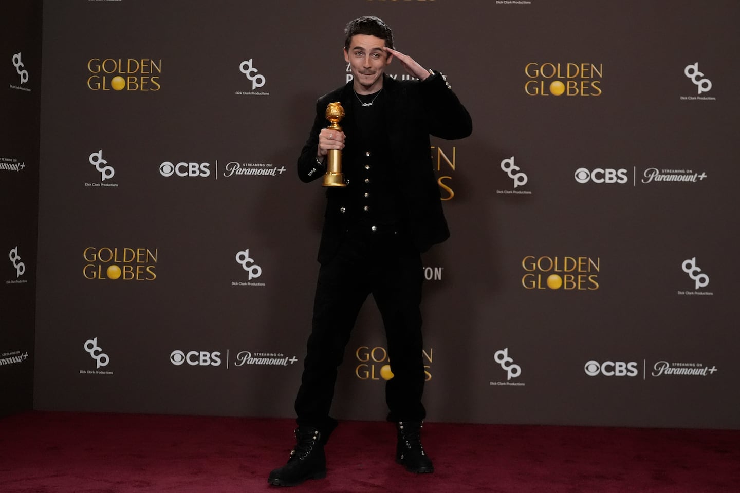 Timothée Chalamet posed in the press room with the award for best performance by a male actor in a motion picture – musical or comedy for "Marty Supreme" during the 83rd Golden Globes on Sunday at the Beverly Hilton in Beverly Hills, Calif. 