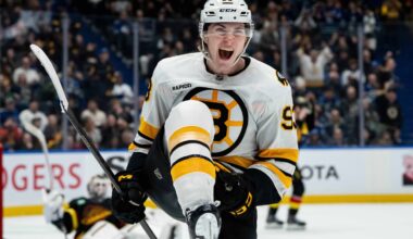 Boston Bruins' Fraser Minten (93) celebrates his game-winning goal against the Vancouver Canucks during overtime in an NHL hockey game in Vancouver, British Columbia, on Saturday, Jan. 3, 2026. (Ethan Cairns/The Canadian Press via AP)