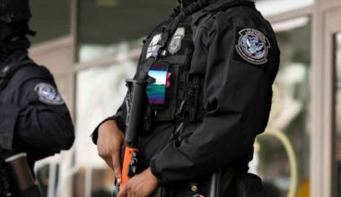 ICE agents stand guard