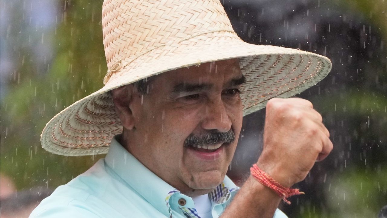 President Nicolas Maduro addresses supporters during a rally marking the anniversary of the Battle of Santa Ines, which took place during Venezuela's 19th-century Federal War, in Caracas, Venezuela, Wednesday, Dec. 10, 2025. (AP Photo/Ariana Cubillos)