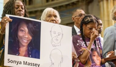 Donna Massey, center right, wipes tears from her face as she listens to Rev. Al Sharpton, right, speak during a press conference over the shooting death of her daughter Sonya, who was killed by Illinois sheriff's deputy Sean Grayson, at New Mount Pilgrim Church in the Garfield Park neighborhood in Chicago, Tuesday, July 30, 2024. (Tyler Pasciak LaRiviere/Chicago Sun-Times via AP, file)