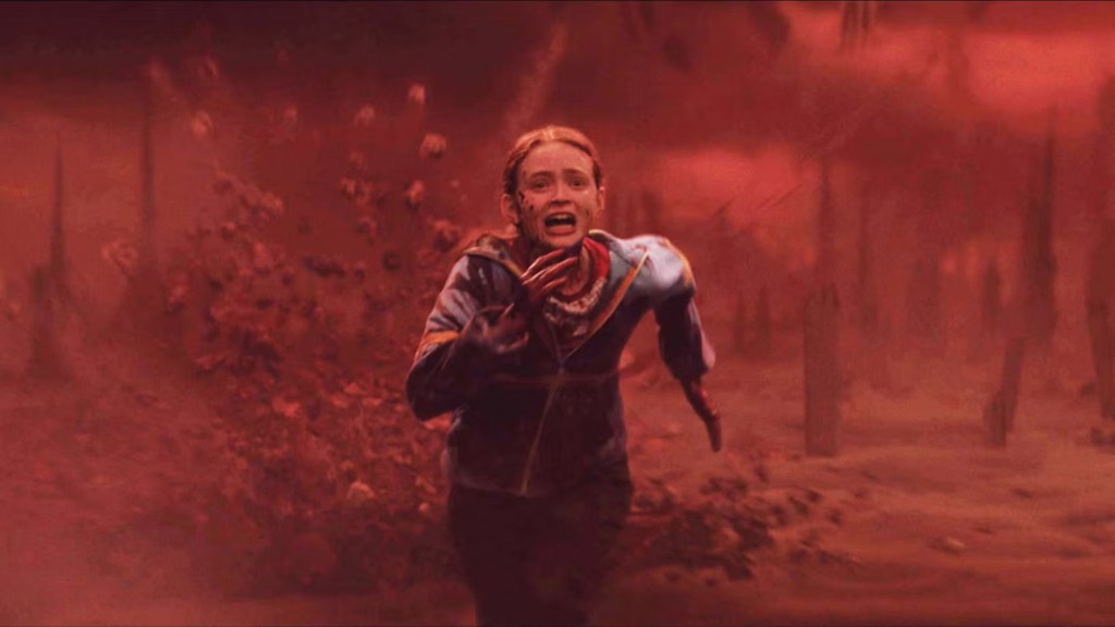 Sadie Sink as Max running through the Upside Down in Stranger Things Season 4