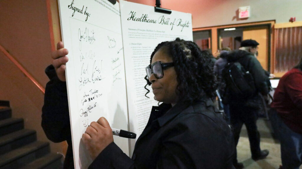 Health care workers, patient advocates and residents from Greater Philadelphia sign a “Healthcare Bill of Rights”