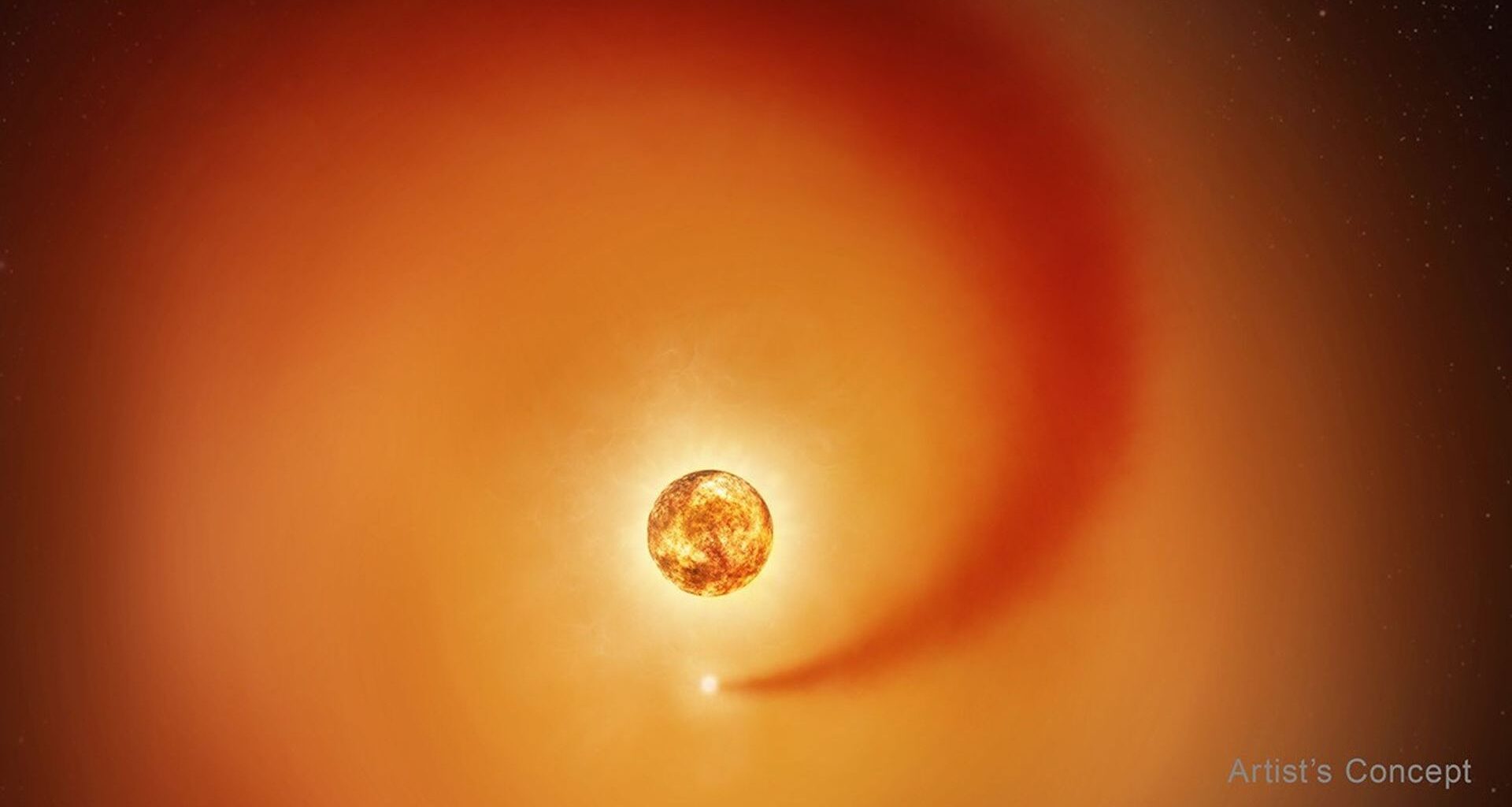 This artist&rsquo;s concept shows the red supergiant star Betelgeuse and an orbiting companion star. The companion, which is orbiting clockwise from this point of view, generates a dense wake of gas that expands outward.