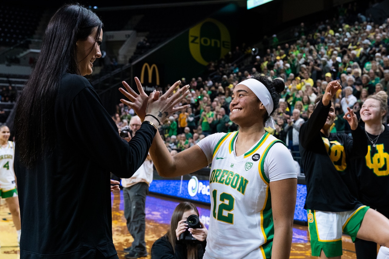 Oregon’s Te-Hina Paopao (right) gets a high five before the Ducks take on the Rice Owls in a second-round WNIT game on Monday, March 20, 2023, at Matthew Knight Arena in Eugene. The Ducks won 78-53.