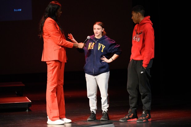 Former professional basketball player and coach Sylvia Crawley Spann, on left, speaks with Edison Lake Station students Brooklynne Walker, center, and Alexander Burts after an exercise during her visit to Indiana University Northwest on Wednesday, Jan. 28, 2026. (Kyle Telechan/for the Post-Tribune)