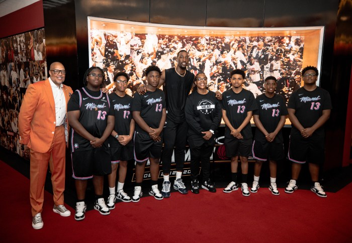 Bam Adebayo poses for a photo with students.