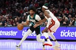 Portland Trail Blazers guard Shaedon Sharpe (17) drives to the basket as Miami Heat center Bam Adebayo (13) defends during the second half of an NBA basketball game Thursday, Jan. 22, 2026, in Portland, Ore.