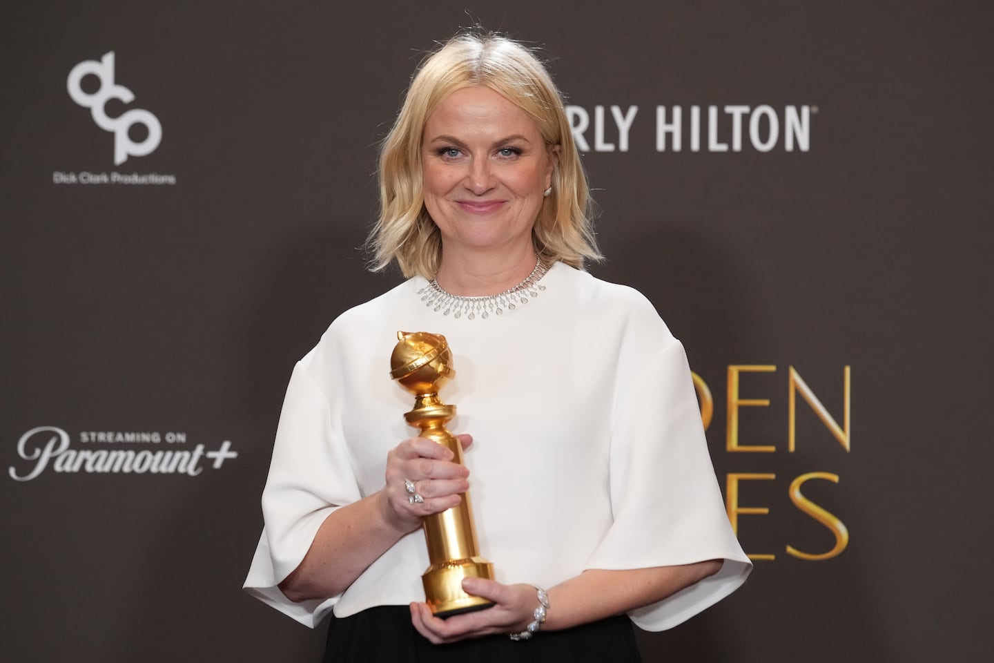 Amy Poehler posed in the press room with the award for best podcast for "Good Hang with Amy Poehler during the 83rd Golden Globes on Sunday at the Beverly Hilton in Beverly Hills, Calif.