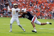 Vanderbilt quarterback Diego Pavia (2) attempts a pass as he scrambles away from Auburn...
