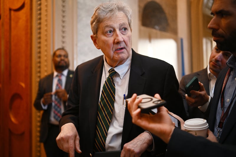 John Kennedy speaks to reporters.