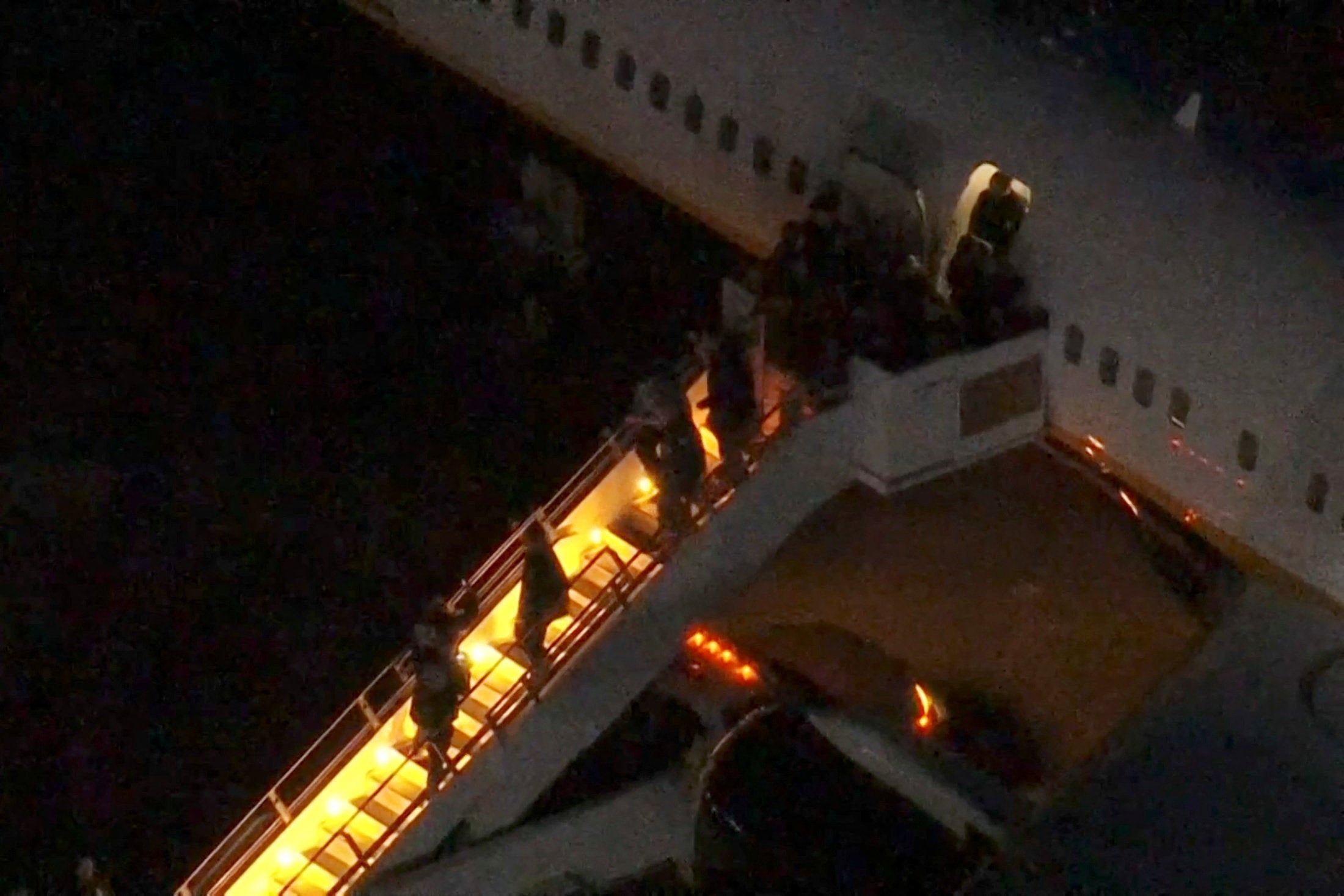 Venezuela's President Nicolas Maduro is led in custody from a U.S. federal airplane before his scheduled court appearance at Manhattan federal court