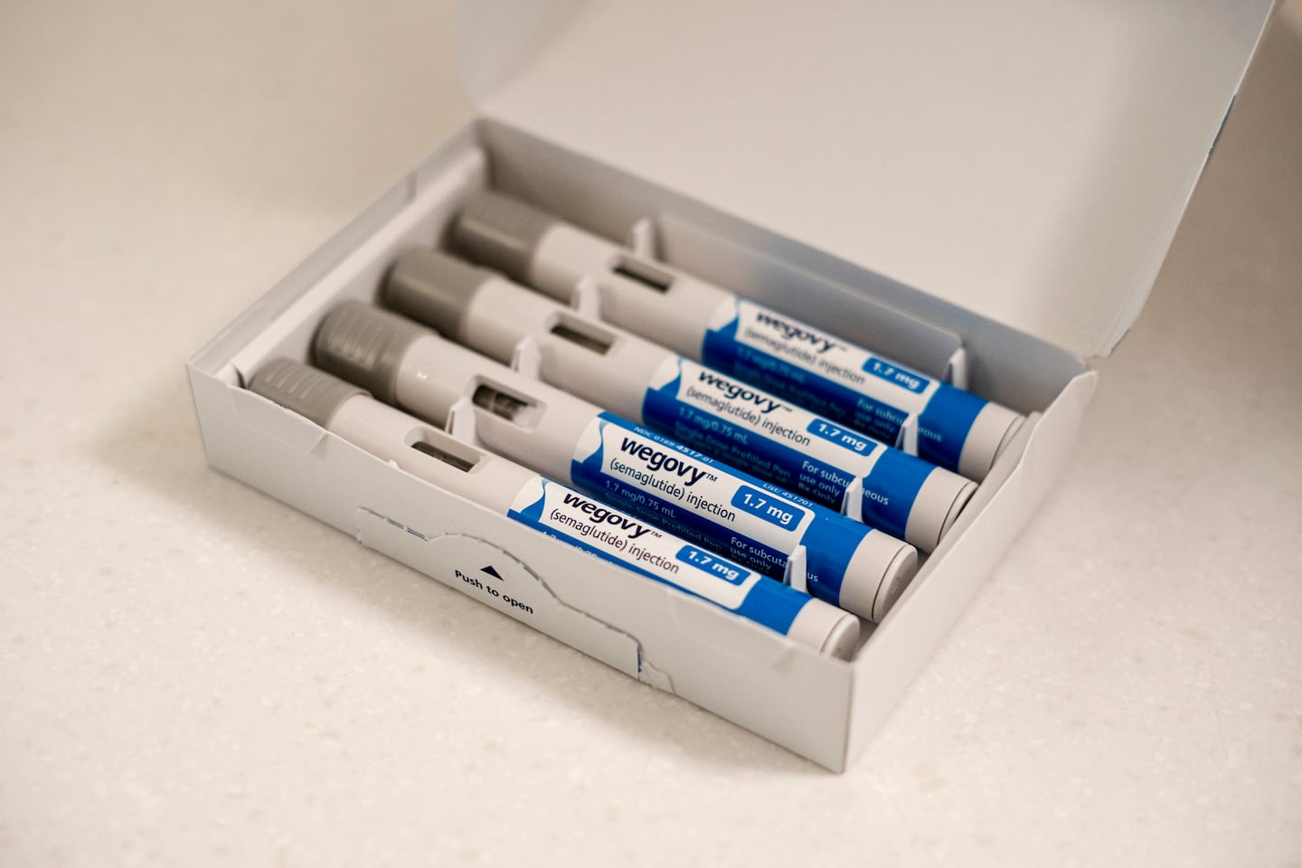 A prescription injector for Ozempic, a weight loss drug, pictured in Portland, Maine. People who stop taking GLP-1 drugs for weight loss are projected to regain their shed pounds within about one and half years.