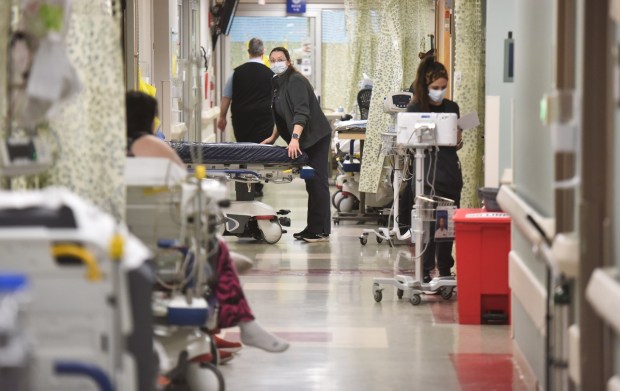 Registered nurses work in the emergency room hallway at Geisinger Community Medical Center in Scranton Friday, January 16, 2026. (SEAN MCKEAG / STAFF PHOTOGRAPHER)