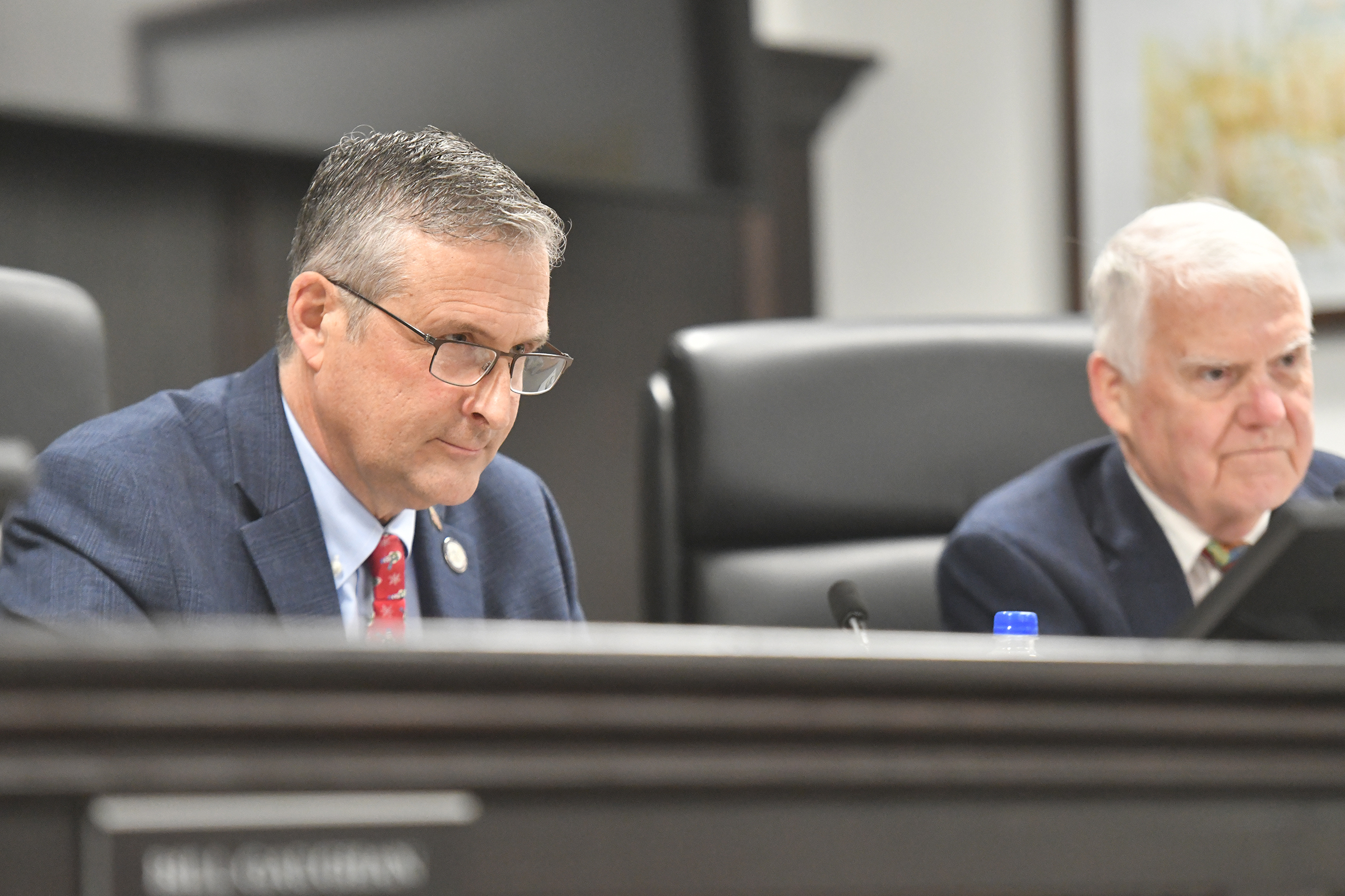 Lackawanna County Commissioners Chris Chermak and Thom Welby listen to...