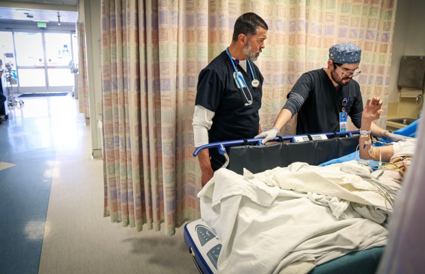 Dr Mark Hernandez, Chief of Emergency Medicine, with a patient in the Emergency Room area at Scripps Mercy Hospital in Chula Vista on Monday, December 29, 2025.Hospitals are at risk of losing significant Medi-Cal reimbursement due to federal budget changes. (Sandy Huffaker / For The San Diego Union-Tribune)