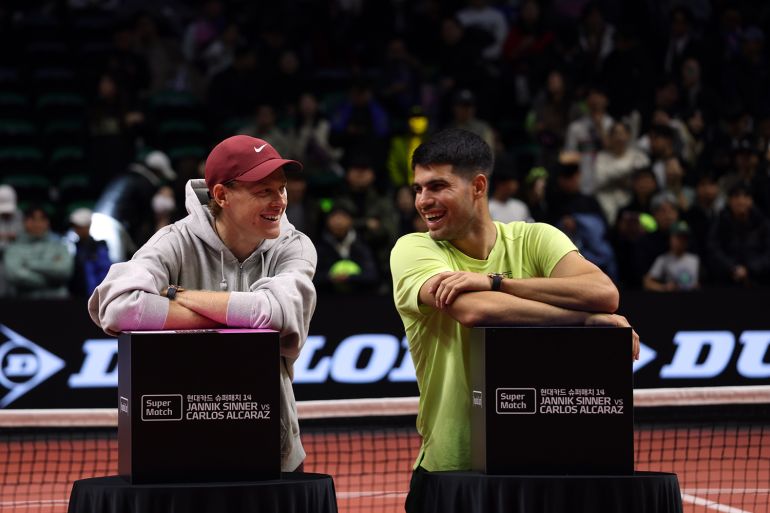Jannik Sinner and Carlos Alcaraz react.