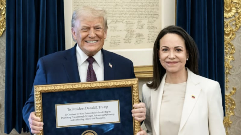 Venezuelan opposition leader Maria Corina Machado presents Donald Trump with her Nobel Peace Prize.