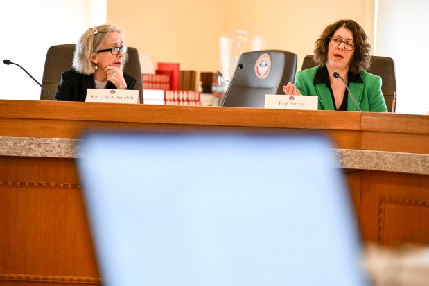 Colorado Rep. Emily Sirota, right, speaks as Sen.-elect Judy Amabile listens during a Joint Budget Committee hearing at the Legislative Services Building in Denver on Thursday, Dec. 19, 2024. (Photo by AAron Ontiveroz/The Denver Post)