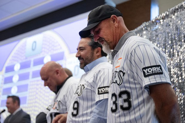Former Colorado Rockies outfield Larry Walker, right, stands with his team of former players in a Family Feud style contest with current Rockies players during Rockies Fest on Saturday at Coors Field in Denver. (Photo by Timothy Hurst/The Denver Post)